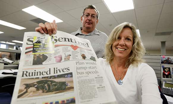 John Maines, Database Editor, and Sally Kestin, Investigative Reporter, pose for photos after they won a Pulitzer Prize for Public Service, at the Sun Sentinel in Fort Lauderdale, Fla.