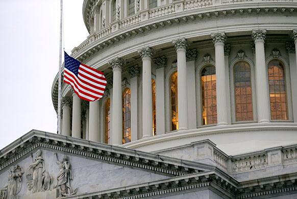 The flag on the East Front of the US Capitol is lowered to half-staff on Capitol Hill, in Washington, after the explosions at the Boston Marathon.