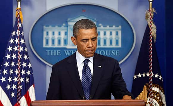President Barack Obama pauses as he begins to speak in the James Brady Press Briefing Room at the White House.