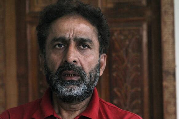 Pakistani banned cricket umpire Nadeem Ghauri talks to reporters after his press conference in Lahore. Ghauri, suspended for four years on corruption charges, says he plans to appeal against the ban.
