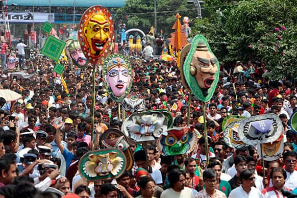 Bangladeshis participate in a parade as they celebrate the first day of