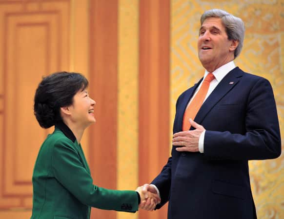South Korean President Park Geun-hye and US Secretary of State John Kerry shake hands before their meeting at the presidential Blue House in Seoul.