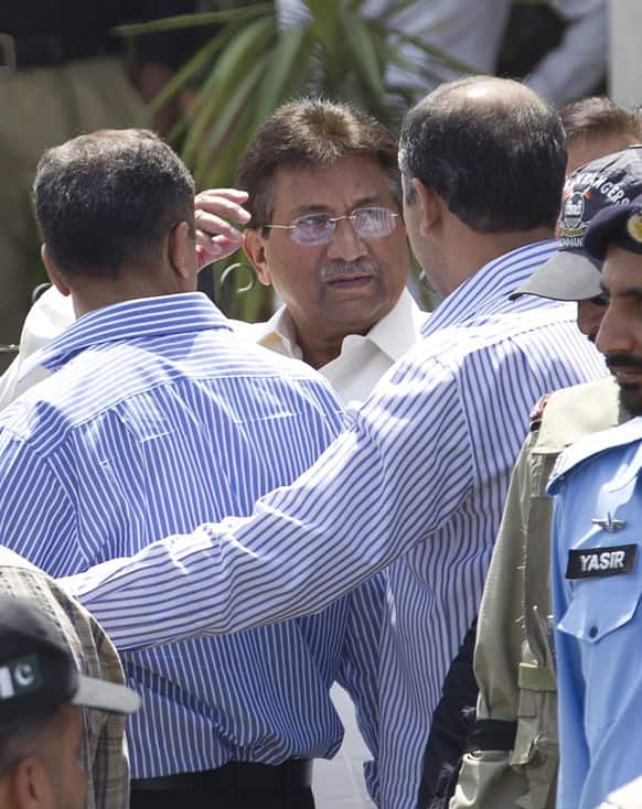 Pakistan`s former president and military ruler Pervez Musharraf gestures as he leaves the High Court building in Islamabad. Musharraf appeared in the court during a hearing pertaining to the judges detention case.