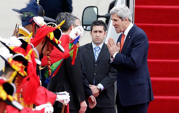 US Secretary of State John Kerry greets upon his arrival at Seoul military airport in Seongnam, South Korea.