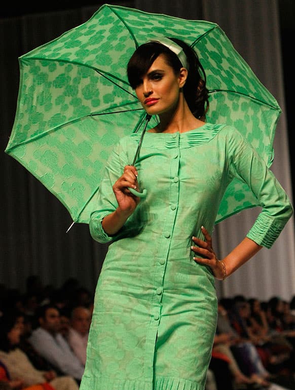 A Pakistani model presents a creation by Kayseria, on the second and last day of Fashion Pakistan Week.