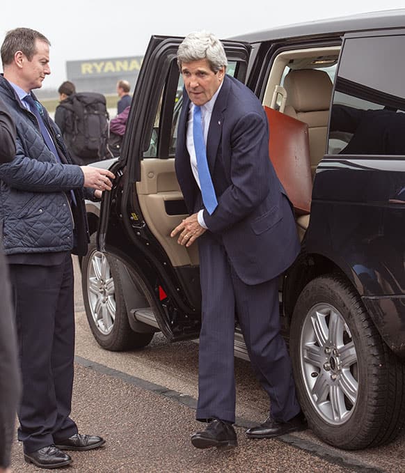 US Secretary of State John Kerry steps out of his vehicle at Stansted Airport as he leaves London, after meeting with officials and attending G-8 meetings.