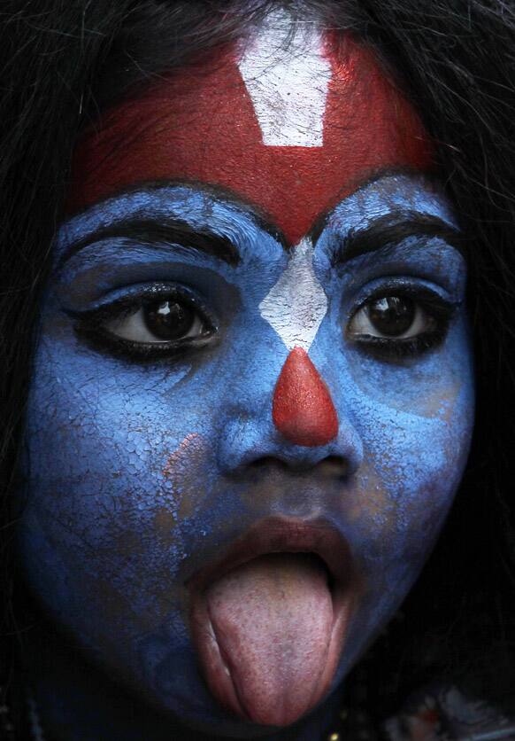 A young girl dresses as Hindu goddess