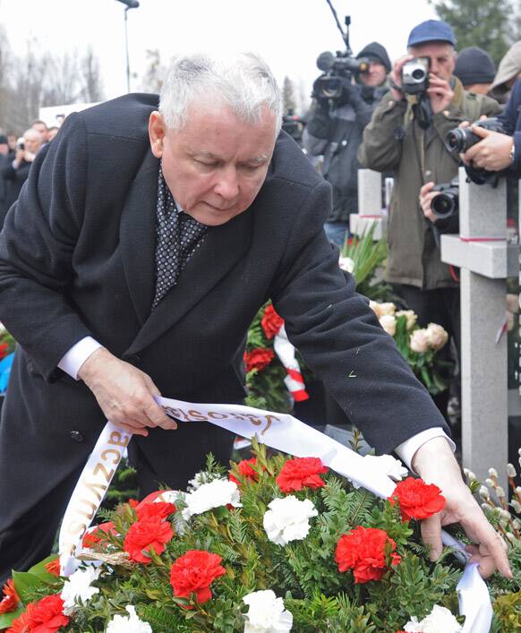 Opposition leader Jaroslaw Kaczynski lays a wreath at the memorial dedicated to the 96 victims of the presidential plane crash, among them his twin brother President Lech Kaczynski, as he commemorates the third anniversary of the accident, at the Powazki cemetery in Poland.