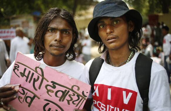People affected with HIV participate in a protest rally to oppose a free trade agreement between India and European Union, in New Delhi.