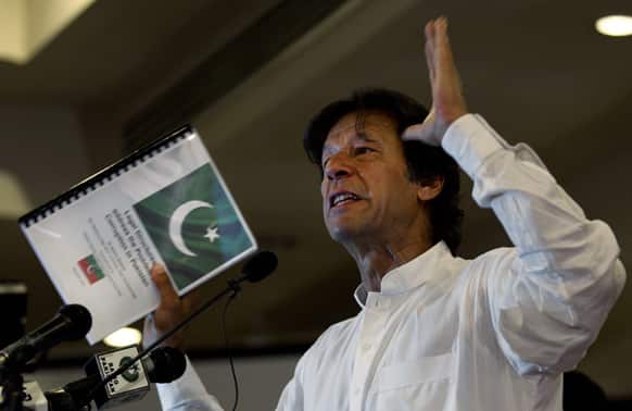 Pakistan`s former cricket star-turned-politician Imran Khan gestures as he speaks about his party, Pakistan Tehreek-e-Insaf in Islamabad.