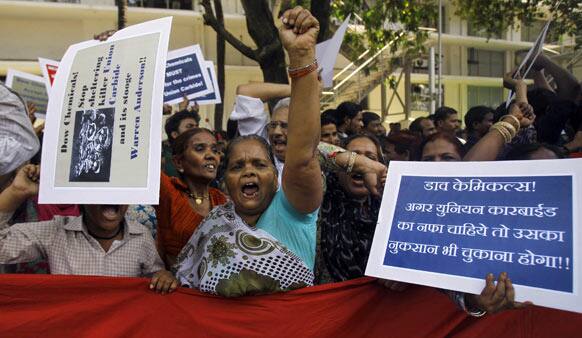 Survivors of the Bhopal Gas Tragedy shout slogans during a protest outside the office of Dow Chemical International Private Ltd. on the outskirts of Mumbai.