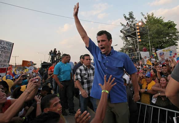 Opposition presidential candidate Henrique Capriles greets supporters during a campaign rally in Puerto La Cruz, Venezuela. Capriles is running against ruling party candidate Nicolas Maduro in next weekend`s presidential election.
