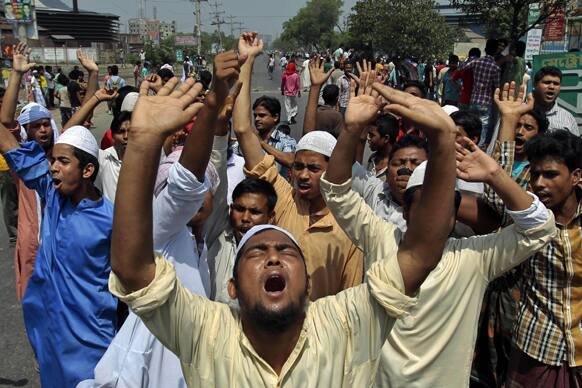Activists of Hifazat-e-Islam shout slogans during a strike in Dhaka, Bangladesh. At least 20 people were injured in southwestern Bangladesh as a hardline Islamic group enforces a general strike to back its demands for an anti-blasphemy law.