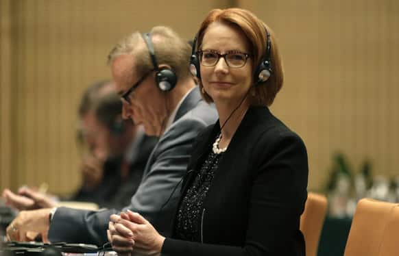 Australian Prime Minister Julia Gillard listens to an English translation of a Chinese speech at China Executive Leadership Academy Pudong (CELAP) in Shanghai, China.