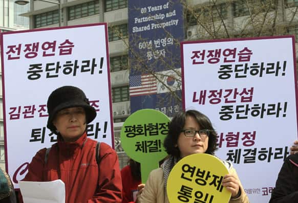 South Korean housewives stage a press conference denouncing the annual joint military exercise known as Foal Eagle, between South Korea and the United States, near the U.S. Embassy in Seoul, South Korea.