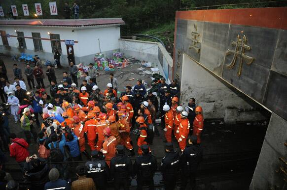 A rescued miner is carried out of the mine shaft of a flooded coal mine in Weng`an County, southwest China`s Guizhou Province.