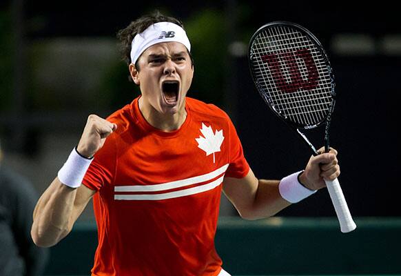 Canada`s Milos Raonic celebrates after defeating Italy`s Andreas Seppi during the fourth set of a Davis Cup tennis quarterfinal singles match in Vancouver.