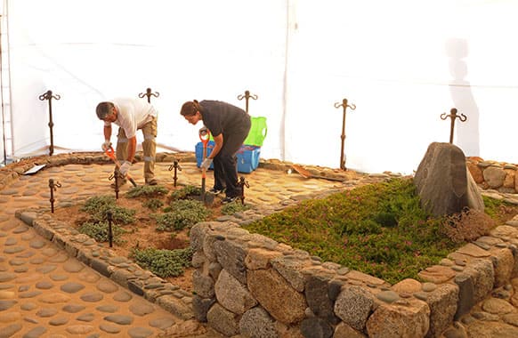 Forensic specialists dig at the grave of Nobel laureate Pablo Neruda as they prepare for the exhumation of the remains in Isla Negra, Chile.