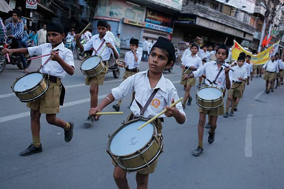 Young volunteers of Hindu nationalist Rashtriya Swayamsevak Sangh (RSS), play drums as they march to mark the upcoming ‘Vikram Samvat’ New Year in Allahabad.