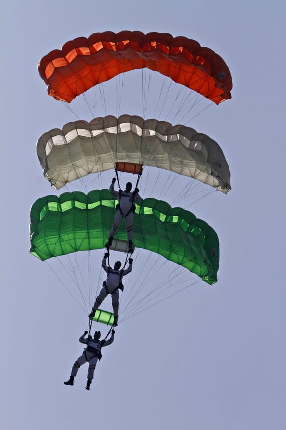 Indian Air Force (IAF) Akash Ganga team perform sky diving depicting the three colors of the Indian flag during a display in Allahabad.