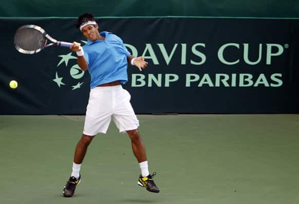 Somdev Devvarman returns a shot to Indonesia`s David Agung Susanto during their Group I Asia-Oceania relegation playoff tennis reverse single match at the Davis Cup between India and Indonesia in Bangalore.