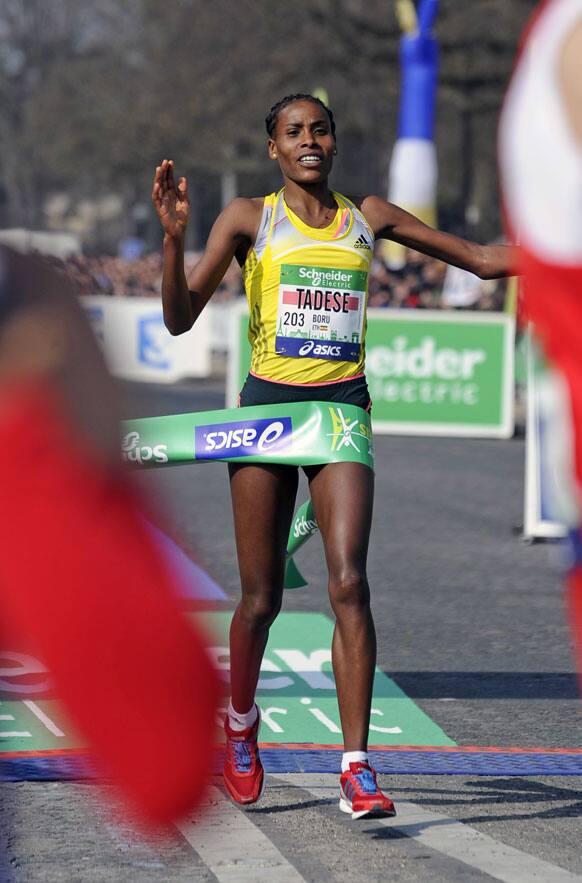 Boru Tadese of Ethiopia crosses first the finish line to win the 37th Paris marathon. Boru Tadese won in 2hours 21 minutes and 6 seconds.