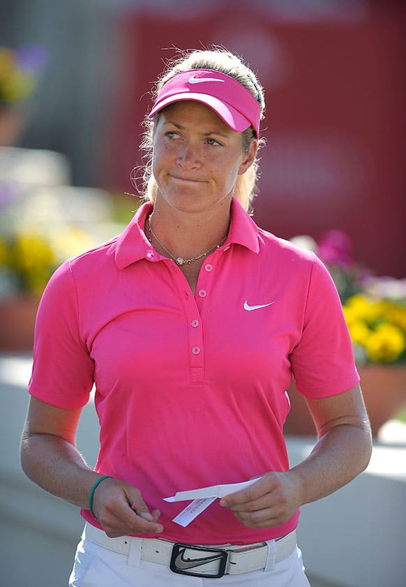 Suzann Pettersen, of Norway, smiles at her fans while they cheer her on after she finished the third round of the LPGA Kraft Nabisco Championship golf tournament in Rancho Mirage, Calif.