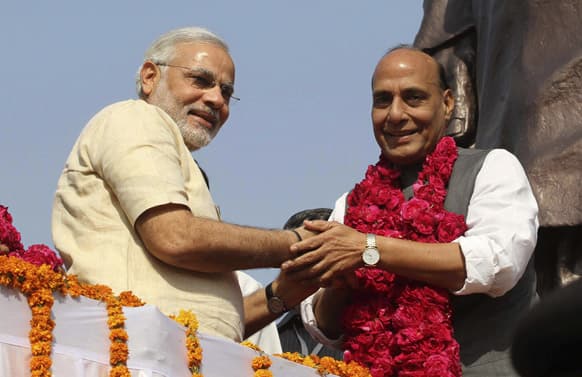 Gujarat state chief minister Narendra Modi welcomes Bharatiya Janata Party (BJP) President Rajnath Singh as he arrives for Foundation Day celebrations of the party in Ahmadabad.