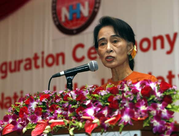 Myanmar opposition leader Aung San Suu Kyi delivers a speech as she attends the inauguration ceremony of NLD National Health Networkat at a hotel in Yangon.
