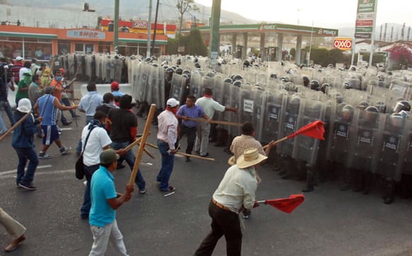 Public school teachers clash with Mexico`s Federal Police after they blocked a highway that connects Mexico City with Acapulco in Chilpancingo, Mexico.