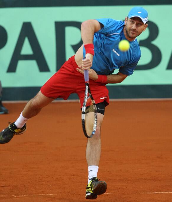 Jan Hajek of Czech Republic returns to Kazakhstan`s Mikhail Kukushkin during a Davis Cup quaterfinal match between Kazakhstan and Czech Republic in Astana, Kazakhstan.