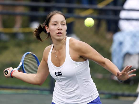 Jessica Pegula returns to Jelena Jankovic, of Serbia, at the Family Circle Cup tennis tournament in Charleston, S.C.
