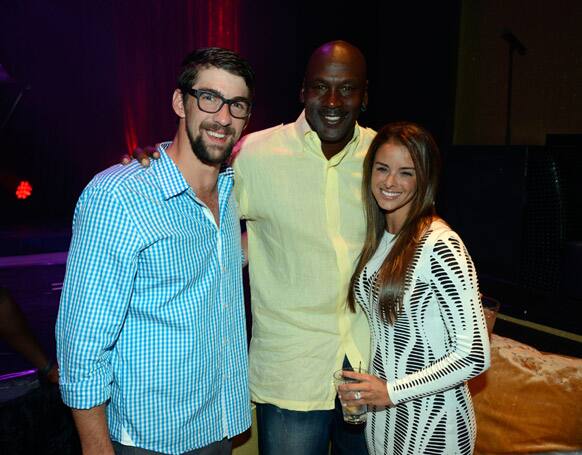 Former U.S. Olympic swimmer Michael Phelps, Charlotte Bobcats owner Michael Jordan and fiancee model Yvette Prieto attend the Michael Jordan Celebrity Invitational opening night dinner in Las Vegas.