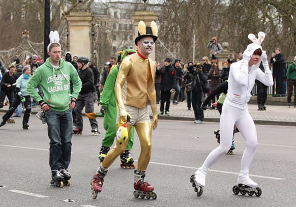 Skaters dressed in flamboyant rabbit costumes leave their starting point at Hyde Park, during the traditional Easter Bunny Stroll charity event, in central London.