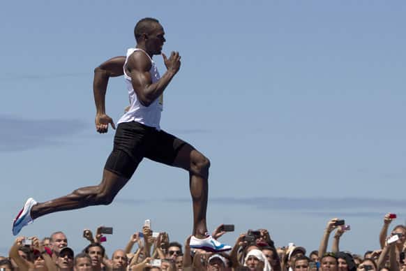 Jamaican Olympic gold medallist Usain Bolt runs to win the