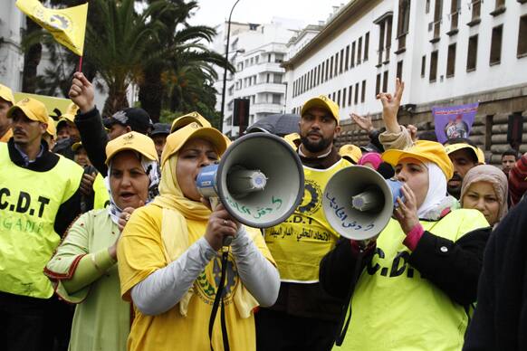 Moroccan women union activists chant slogans through loud speakers bearing the name of their CDT union in Arabic.