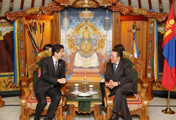 Japanese Prime Minister Shinzo Abe, left, meets with Mongolian President Tsakhia Elbegdorj on the first day of his two-day visit to Ulan Bator, Mongolia.