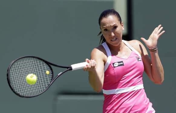 Jelena Jankovic, of Serbia, returns to Maria Sharapova, of Russia, during the semifinals of the Sony Open tennis tournament in Key Biscayne, Fla.