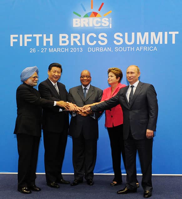 BRICS leaders, from left, Indian Prime Minister Manmohan Singh , Chinese President Xi Jinping , South African President Jacob Zuma Brazil`s President Dilma Rousseff and Russian President Vladimir Putin pose for a group picture during the BRICS 2013 Summit in Durban.