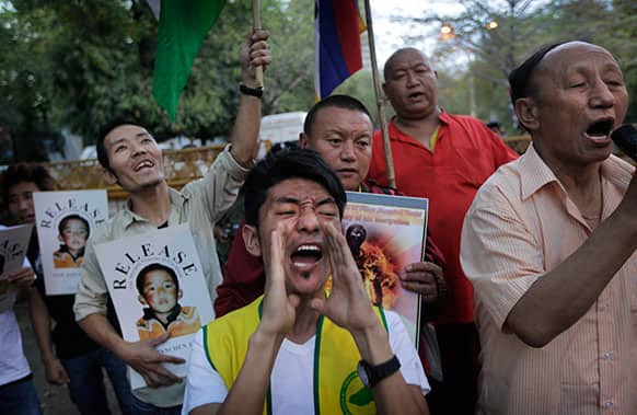 Exile Tibetans shout slogans against China demanding the release of Panchen Lama during a protest in New Delhi.