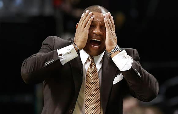 Boston Celtics head coach Doc Rivers reacts to a call against his team during the fourth quarter of their 100-85 loss to the New York Knicks in an NBA basketball game in Boston.