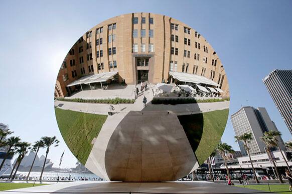 A giant 10 meter (32.8 feet) wide stainless steel disc titled