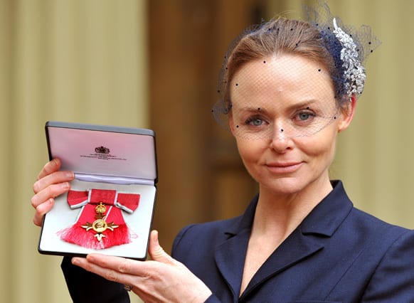 Fashion designer Stella McCartney holds her Officer of the British Empire (OBE) award after an investiture ceremony at Buckingham Palace in central London.