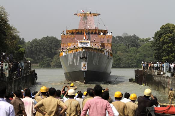 Indian cheer during the launch of Indian Navy’s anti-submarine warfare corvette INS Kiltan on the Ganges river in Kolkata. The Indian built corvette is named after the Kiltan island in India’s Lakshwadeep archipelago.