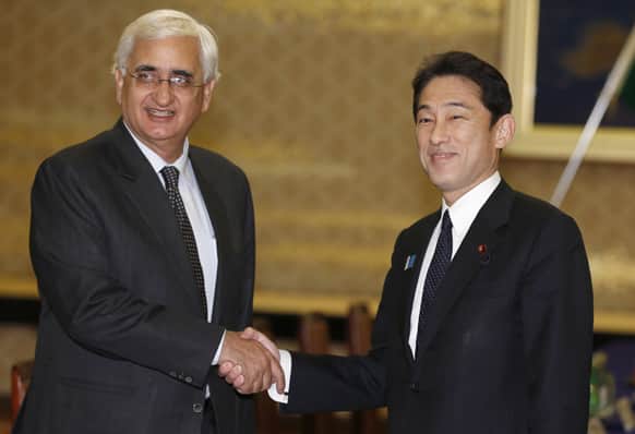 Foreign Minister Salman Khurshid and his Japanese counterpart Fumio Kishida pose for photographers prior to their meeting at Foreign Ministry`s Iikura guesthouse in Tokyo.