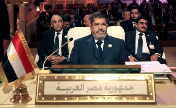 Egyptian President Mohammed Morsi, center, attends the opening session of the Arab League summit in Doha, Qatar.