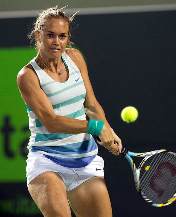 Klara Zakopalova, of the Czech Republic, returns to Maria Sharpova, of Russia, during the Sony Open Tennis tournament in Key Biscayne, Fla.