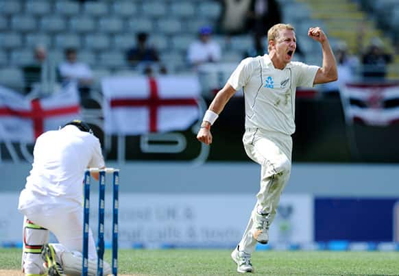 New Zealand`s Neil Wagner, right, celebrates after taking the wicket of England`s Ian Bell, left, for 75 on the fifth day of the 3rd international cricket test, at Eden Park, in Auckland, New Zealand.