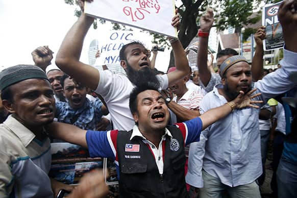 Myanmar Muslims living in Malaysia shout slogans during a protest against ethnic unrest between Buddhists and Muslim in Meikhtila, Myanmar, in Kuala Lumpur, Malaysia.