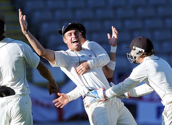 New Zealand`s Tim Southee celebrates after taking the catch to dismiss England`s Steven Finn for 0 on the fourth day of the 3rd international cricket test at Eden Park in Auckland, New Zealand.